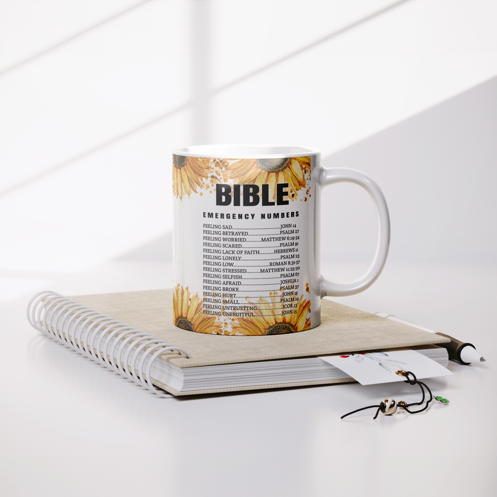 Bible_Emergency_Numbers_-_11oz_Coffee_Mu_Lifestyle_Notebook_Mockup.png_13803667